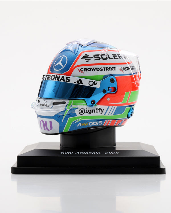 Kimi Antonelli 2026 1:5 scale Mercedes-AMG F1 helmet replica with a blue visor on a black display stand.
